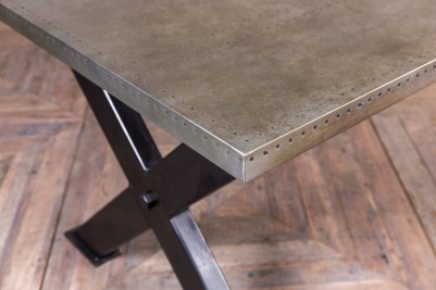 dudley-x-frame-dining-table-zinc-top-close-up